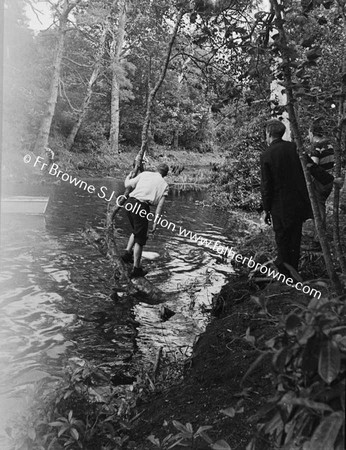 AT THE LAKE CLEARING THE CHANNEL AT THE BACK OF THE ISLAND